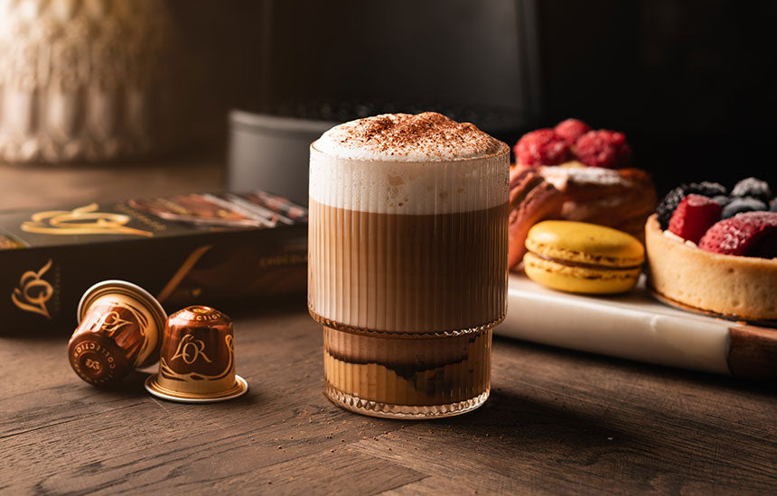 Chocolate Peanut Butter Latte shown with L'OR espresso capsules and assorted cafe items