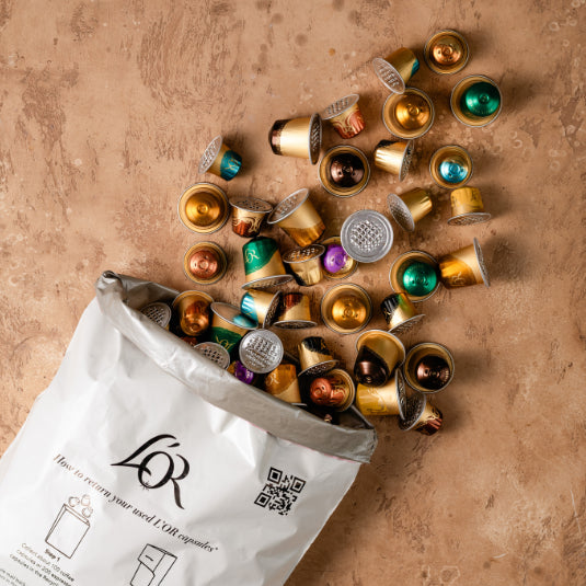 Image of capsules and recycling bag