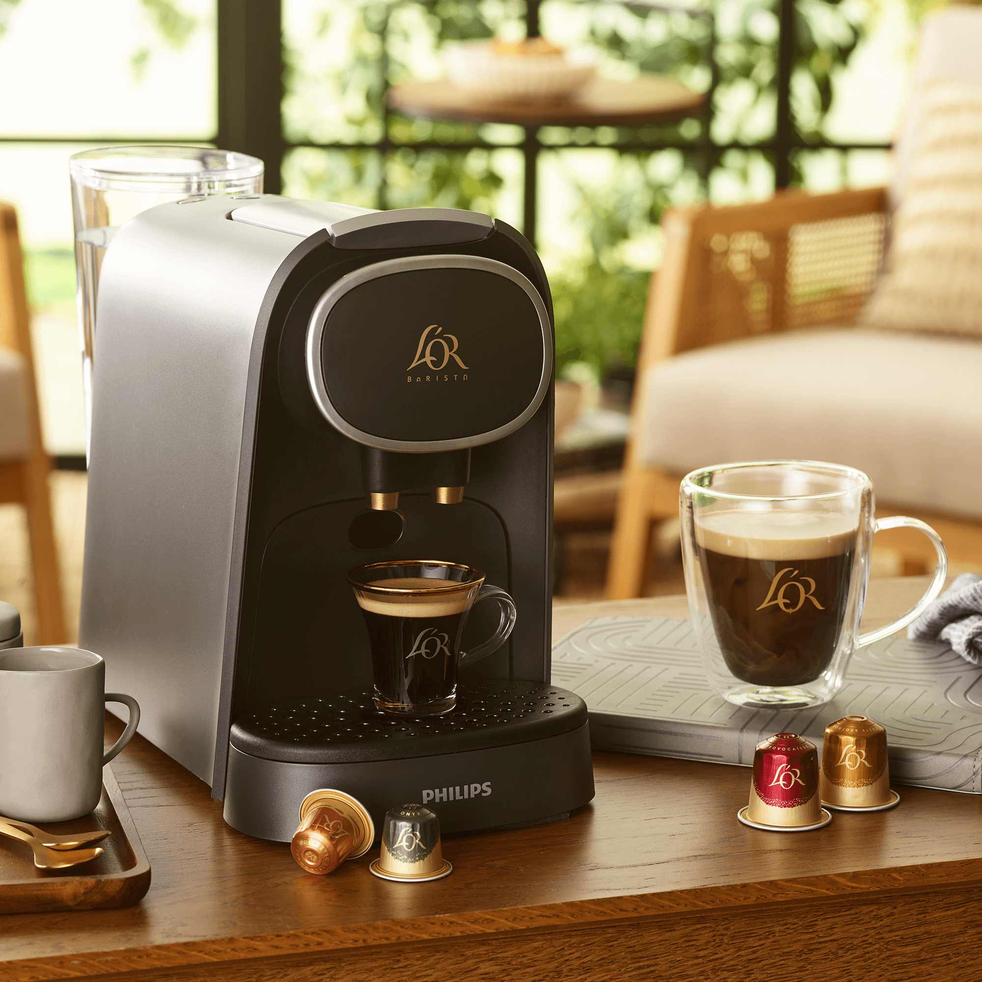 Image of L'OR Barista with cups and capsules
